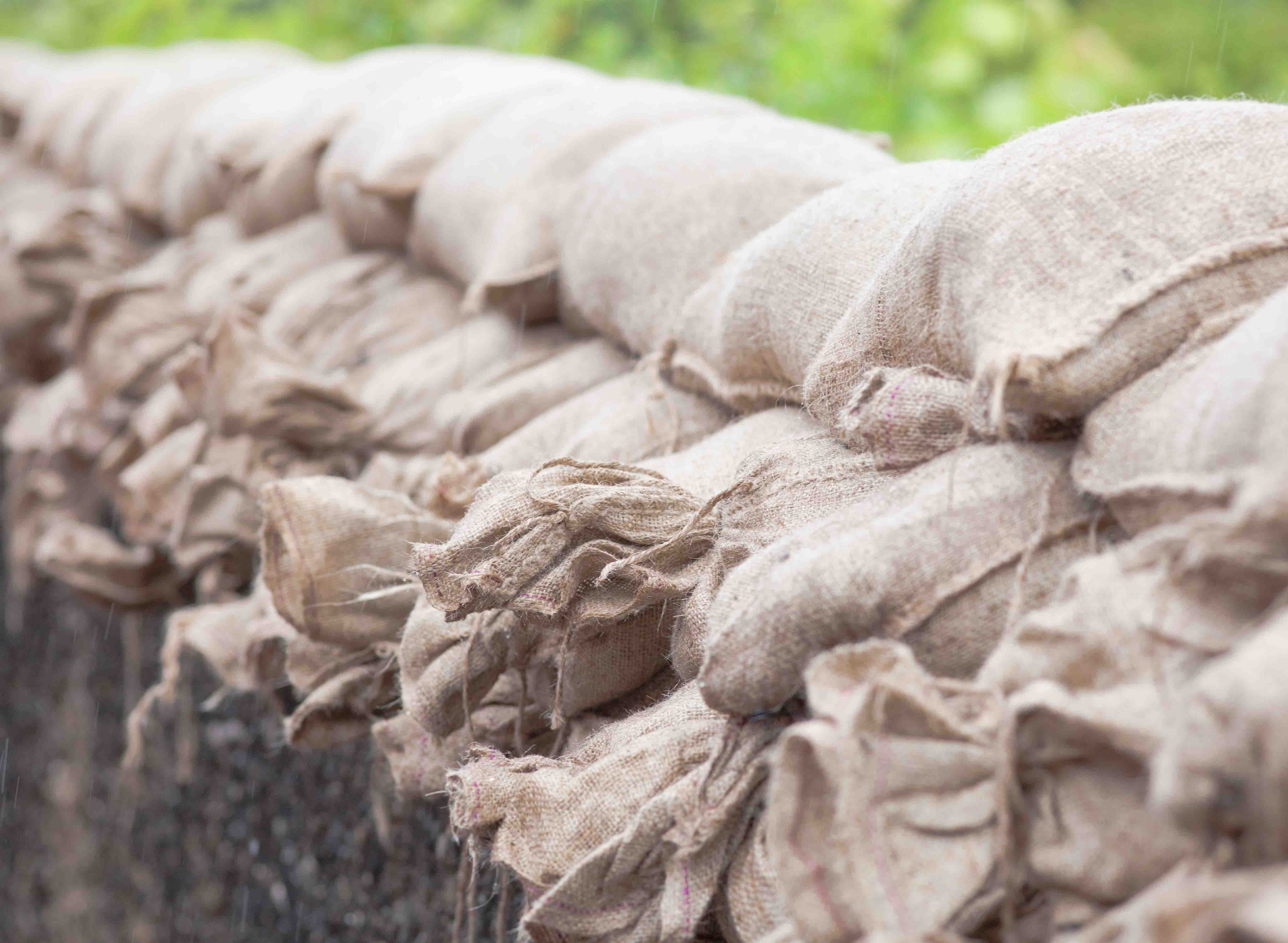 Sandbags on floodwater to stop the water who comes in. picture with short focus.